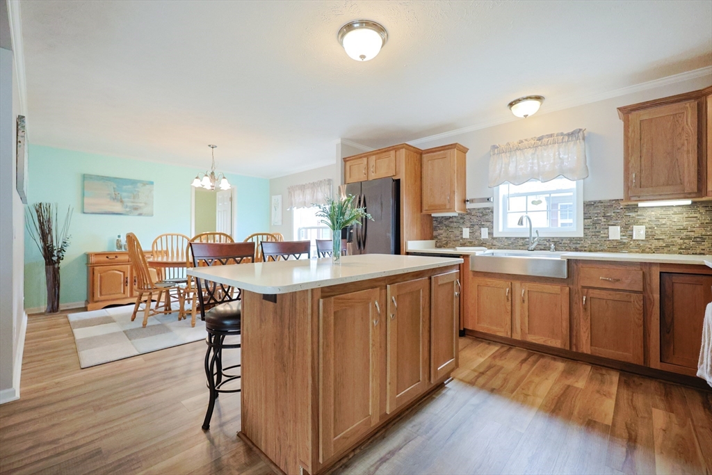 12 Linsay Drive Raynham, MA 02767 - Photo 11 of 28 a large kitchen with a table and chairs