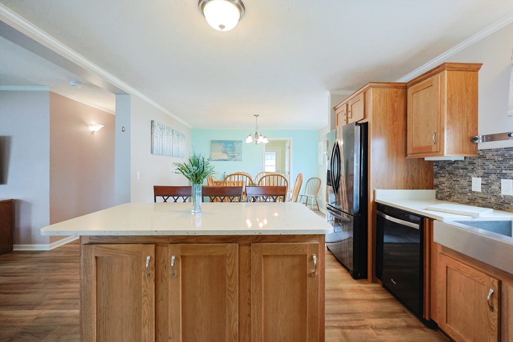 12 Linsay Drive Raynham, MA 02767 - Photo 12 of 28 a kitchen with stainless steel appliances a sink stove and refrigerator