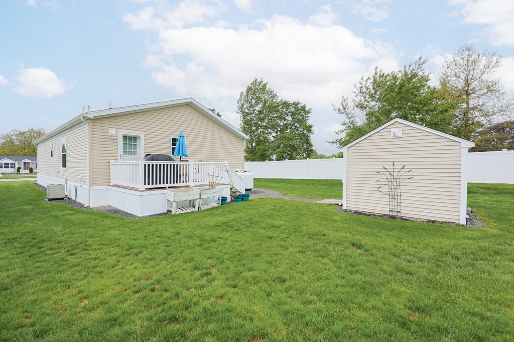 12 Linsay Drive Raynham, MA 02767 - Photo 27 of 28 a view of a house with a backyard