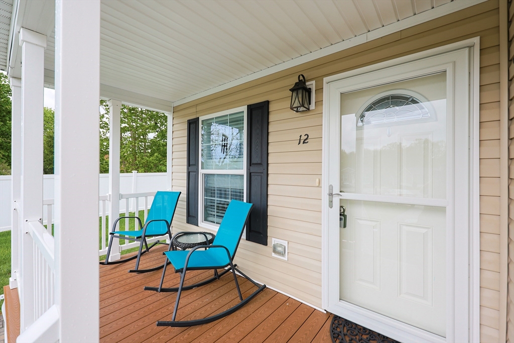 12 Linsay Drive Raynham, MA 02767 - Photo 4 of 28 a view of a door and chair in the balcony