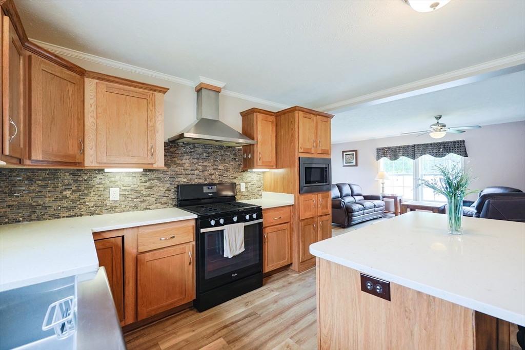 12 Linsay Drive Raynham, MA 02767 - Photo 9 of 28 a kitchen with stainless steel appliances granite countertop a stove a sink dishwasher and a refrigerator