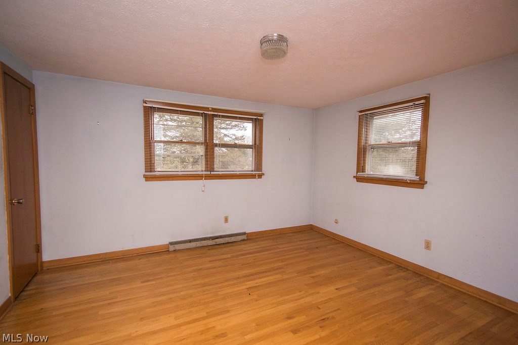 1877 Spring Valley Avenue Northwest Canton, OH 44708 - Photo 17 of 24 Master bedroom with nice hardwood floors featuring a master bath.