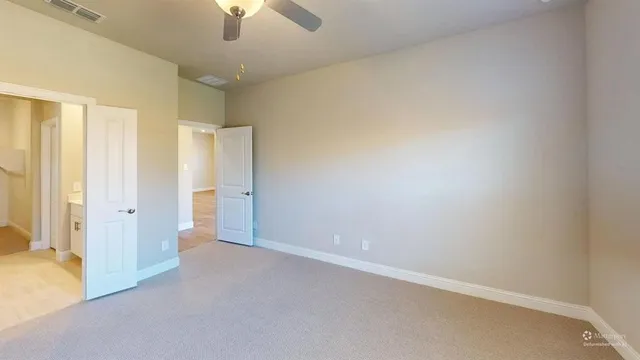 an empty room with a bathroom