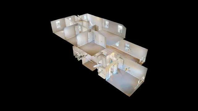 a white vase with flowers sitting on a table