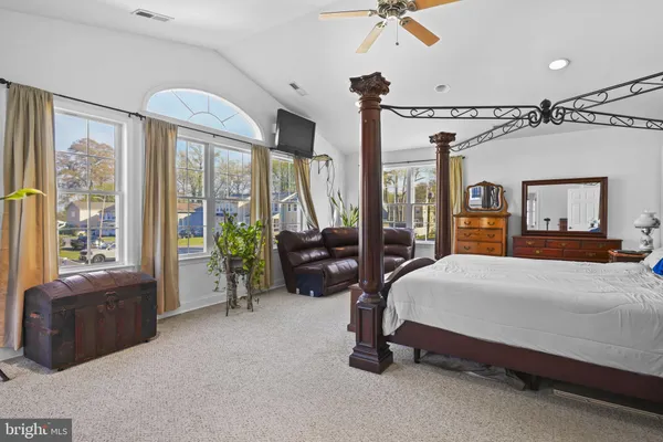 a view of a balcony with chair and wooden floor