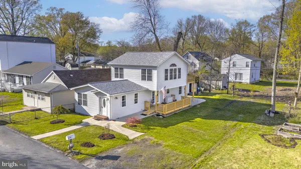 a swimming pool with outdoor seating and yard