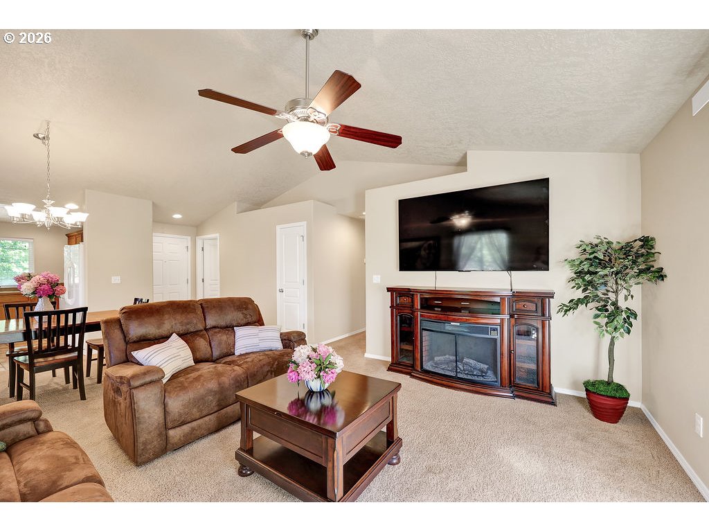 87836 8th Street Veneta, OR 97487 - Photo 5 of 25 a living room with furniture and a flat screen tv