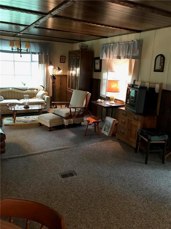 267 Allen Road Wells, ME 04090 - Photo 1 of 6 Large living area with big windows.