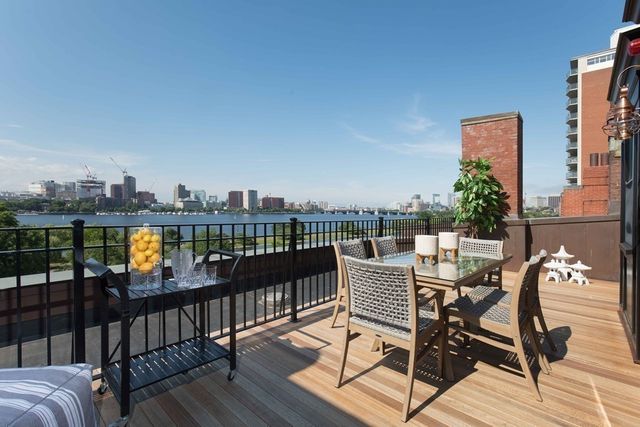 a view of a chairs on the roof deck