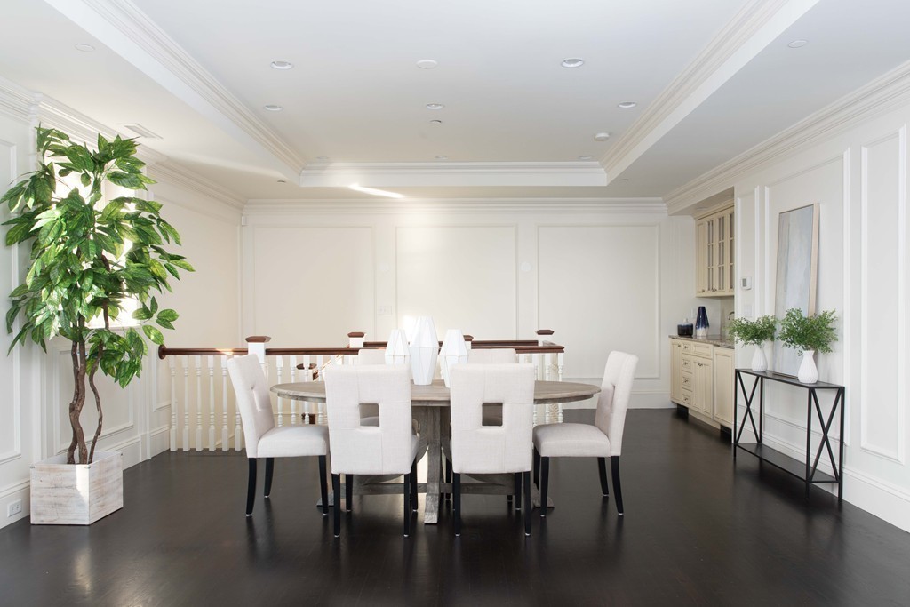348 Beacon Street, Unit PH Boston, MA 02116 - Photo 17 of 34 a view of a dining room with furniture and wooden floor