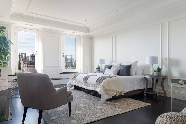 a bedroom with bed and a couch