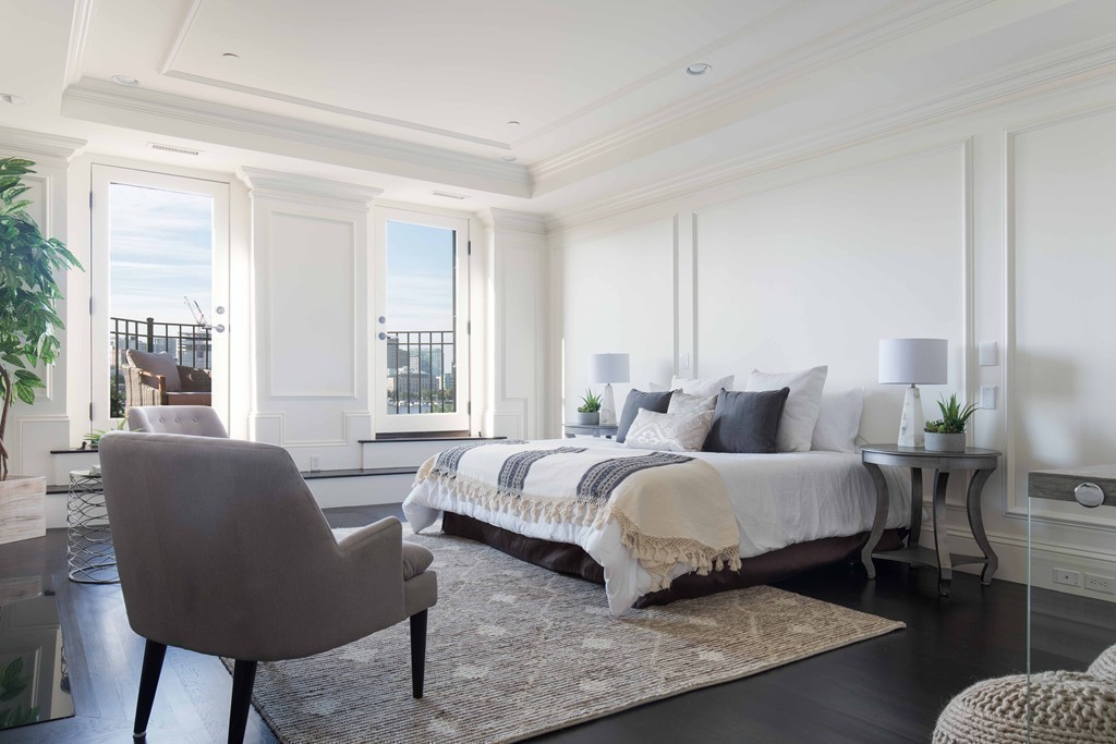 348 Beacon Street, Unit PH Boston, MA 02116 - Photo 20 of 34 a bedroom with bed and a couch