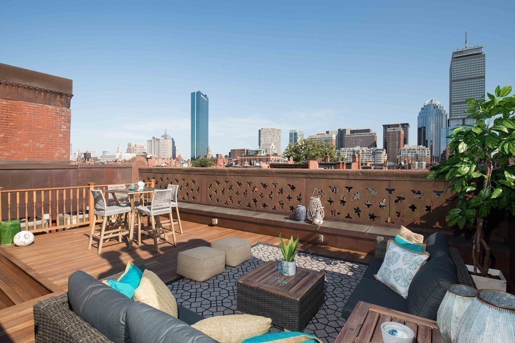 348 Beacon Street, Unit PH Boston, MA 02116 - Photo 2 of 34 a view of a balcony with furniture