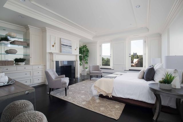 a living room with furniture fireplace and window