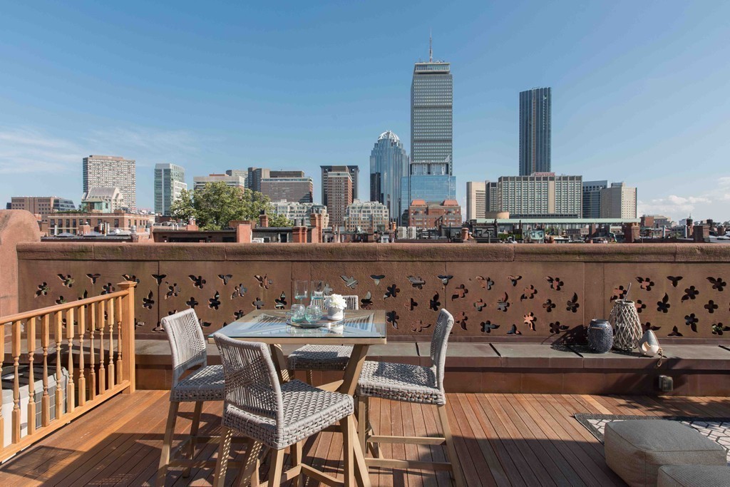 348 Beacon Street, Unit PH Boston, MA 02116 - Photo 29 of 34 a view of a dining room with furniture and wooden floor