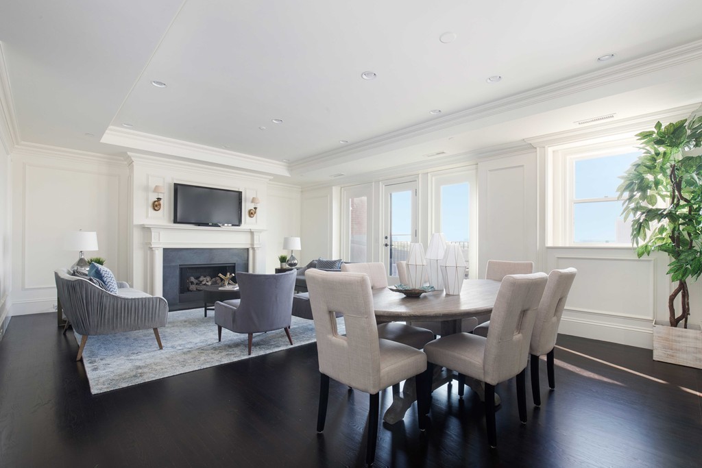 348 Beacon Street, Unit PH Boston, MA 02116 - Photo 3 of 34 a view of a dining room with furniture window and wooden floor