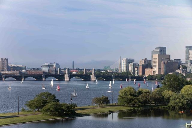 a view of a water with a large building and lake view