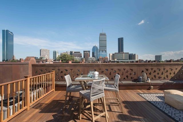 a view of a chairs and table on the terrace
