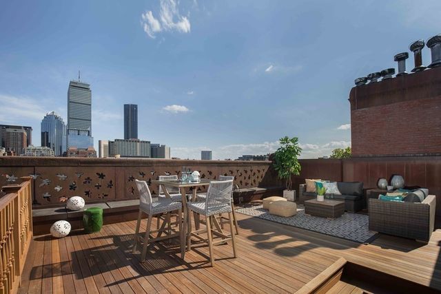 a view of a terrace with seating area