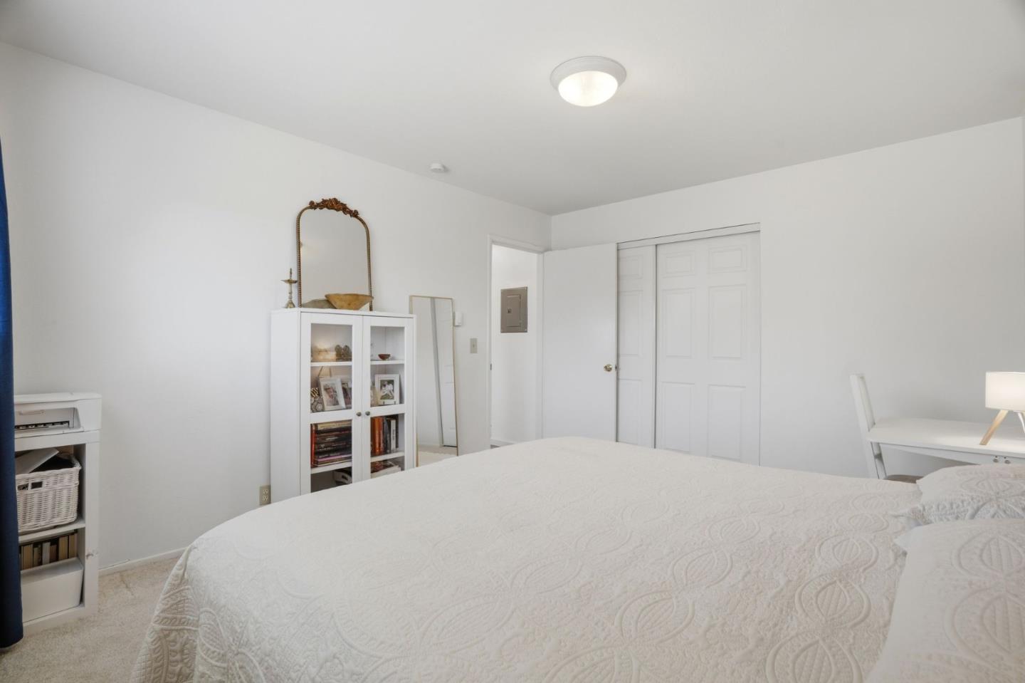 2025 California Street, Unit 40 Mountain View, CA 94040 - Photo 20 of 31 a bedroom with a bed and a closet
