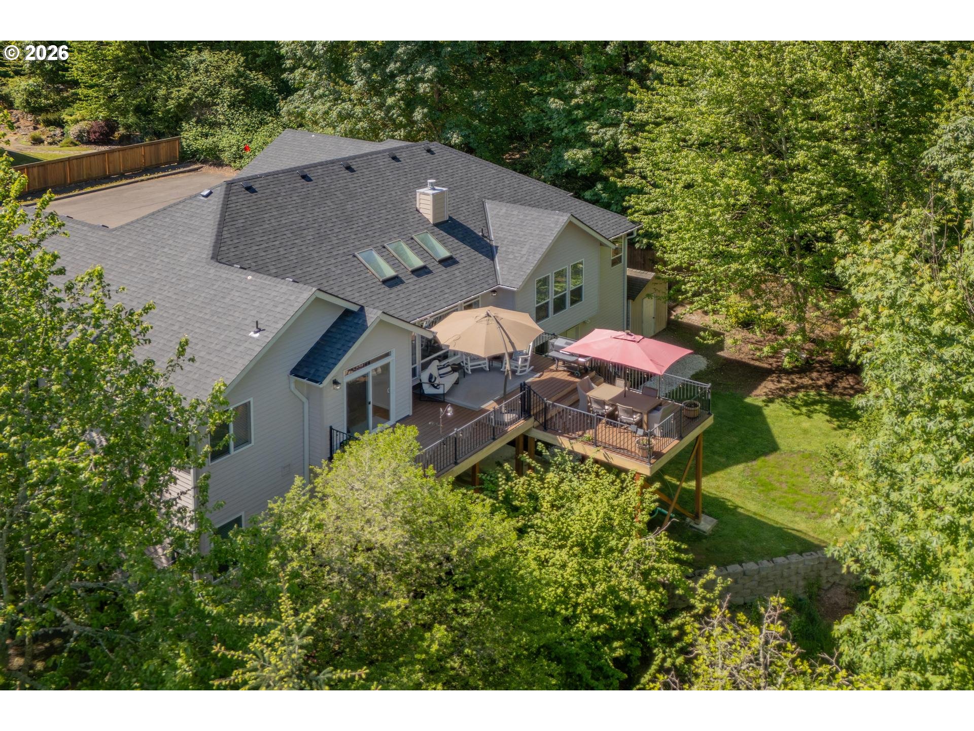 2097 Southwest Nancy Drive Gresham, OR 97080 - Photo 2 of 46 a view of a house with a backyard and a garden
