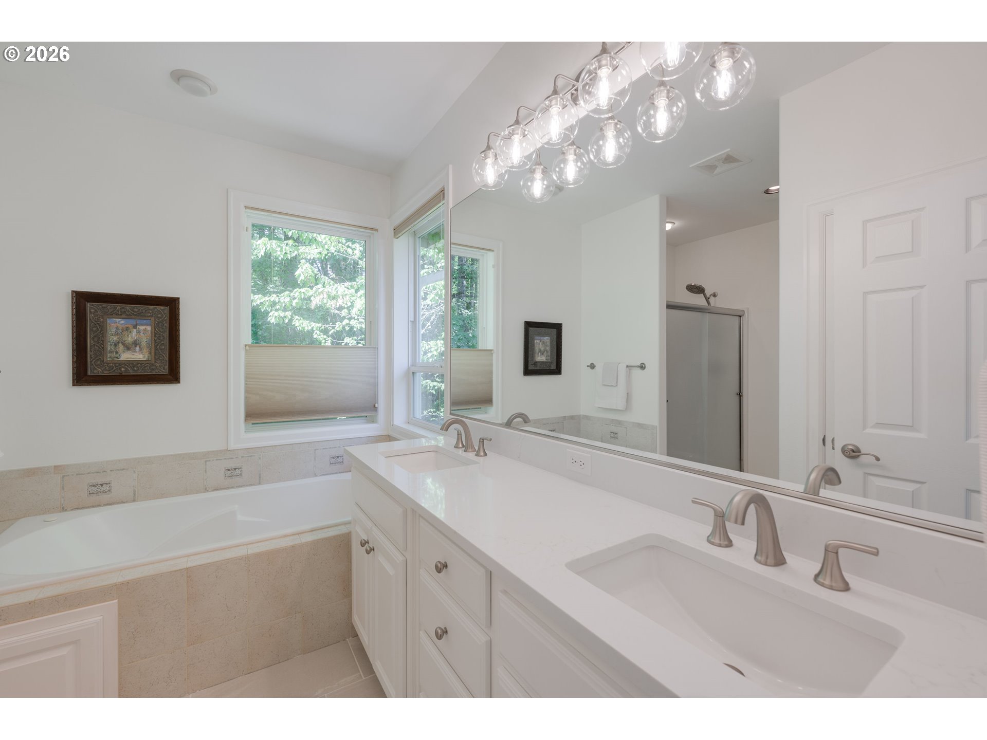 2097 Southwest Nancy Drive Gresham, OR 97080 - Photo 26 of 46 a bathroom with a sink a large mirror and a bathtub