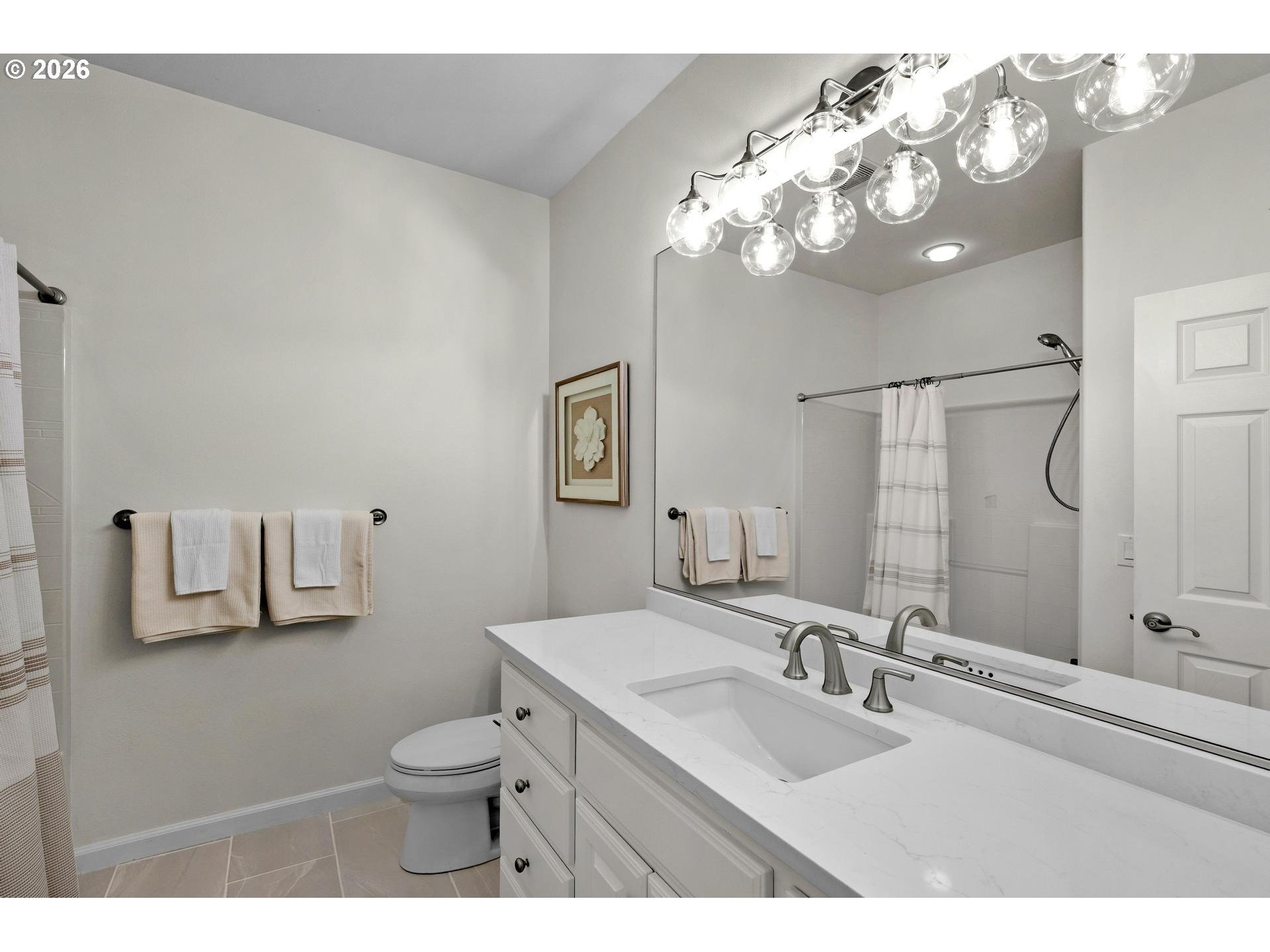 2097 Southwest Nancy Drive Gresham, OR 97080 - Photo 30 of 46 a bathroom with a toilet a sink a mirror and vanity