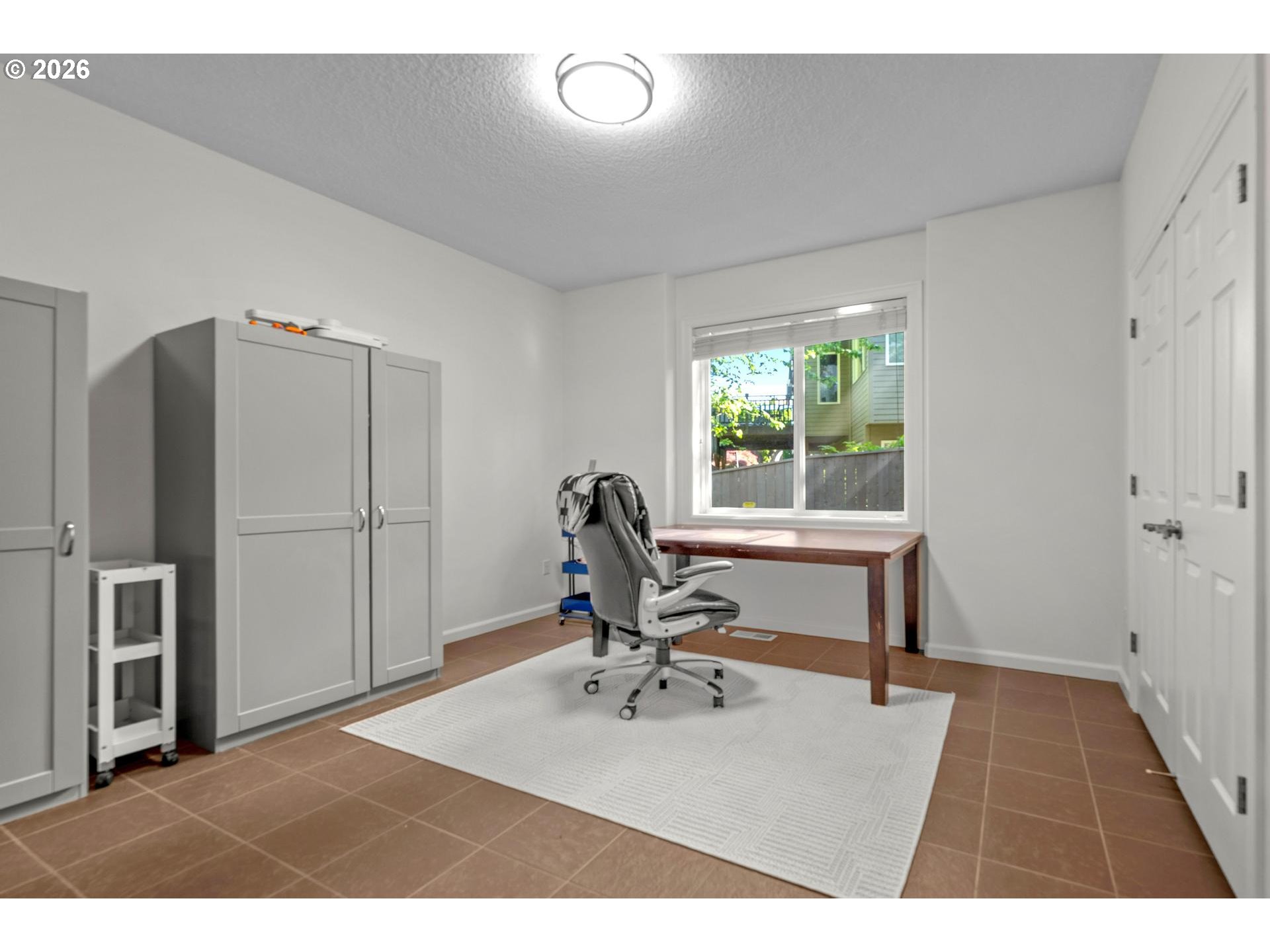 2097 Southwest Nancy Drive Gresham, OR 97080 - Photo 34 of 46 a view of a workspace with furniture and a window