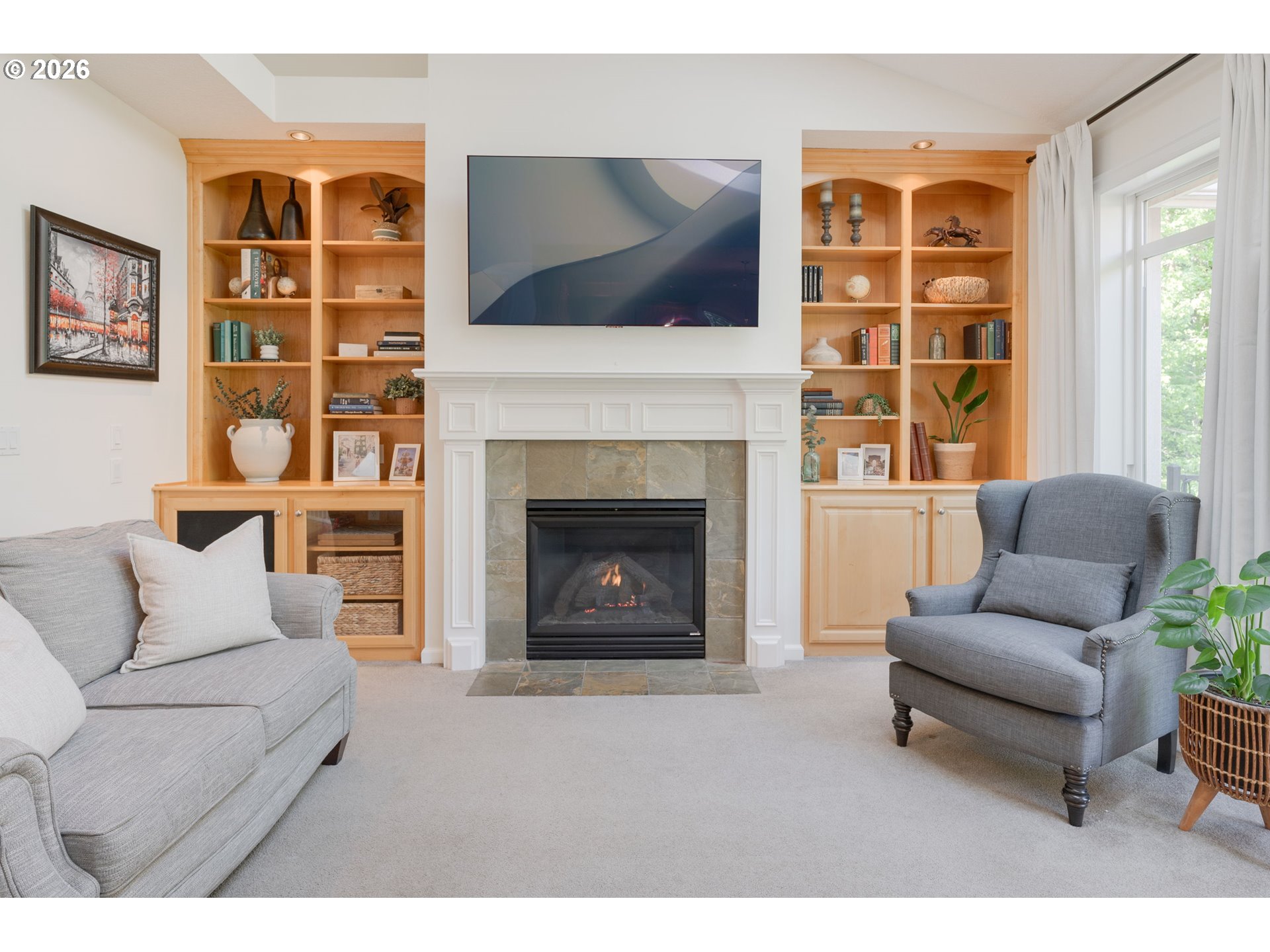 2097 Southwest Nancy Drive Gresham, OR 97080 - Photo 6 of 46 a living room with furniture a flat screen tv and a fireplace
