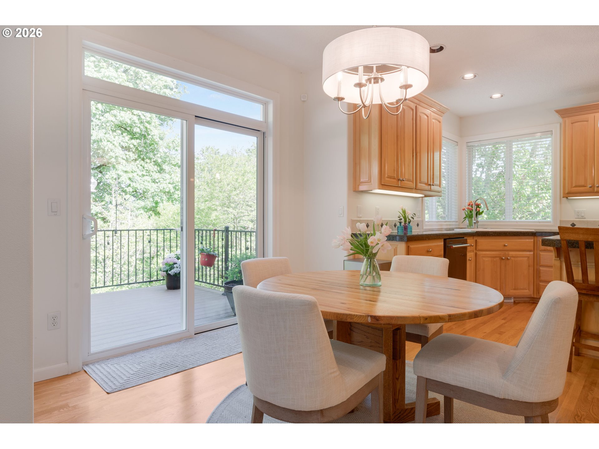 2097 Southwest Nancy Drive Gresham, OR 97080 - Photo 10 of 46 a view of a dining room with furniture wooden floor and a chandelier