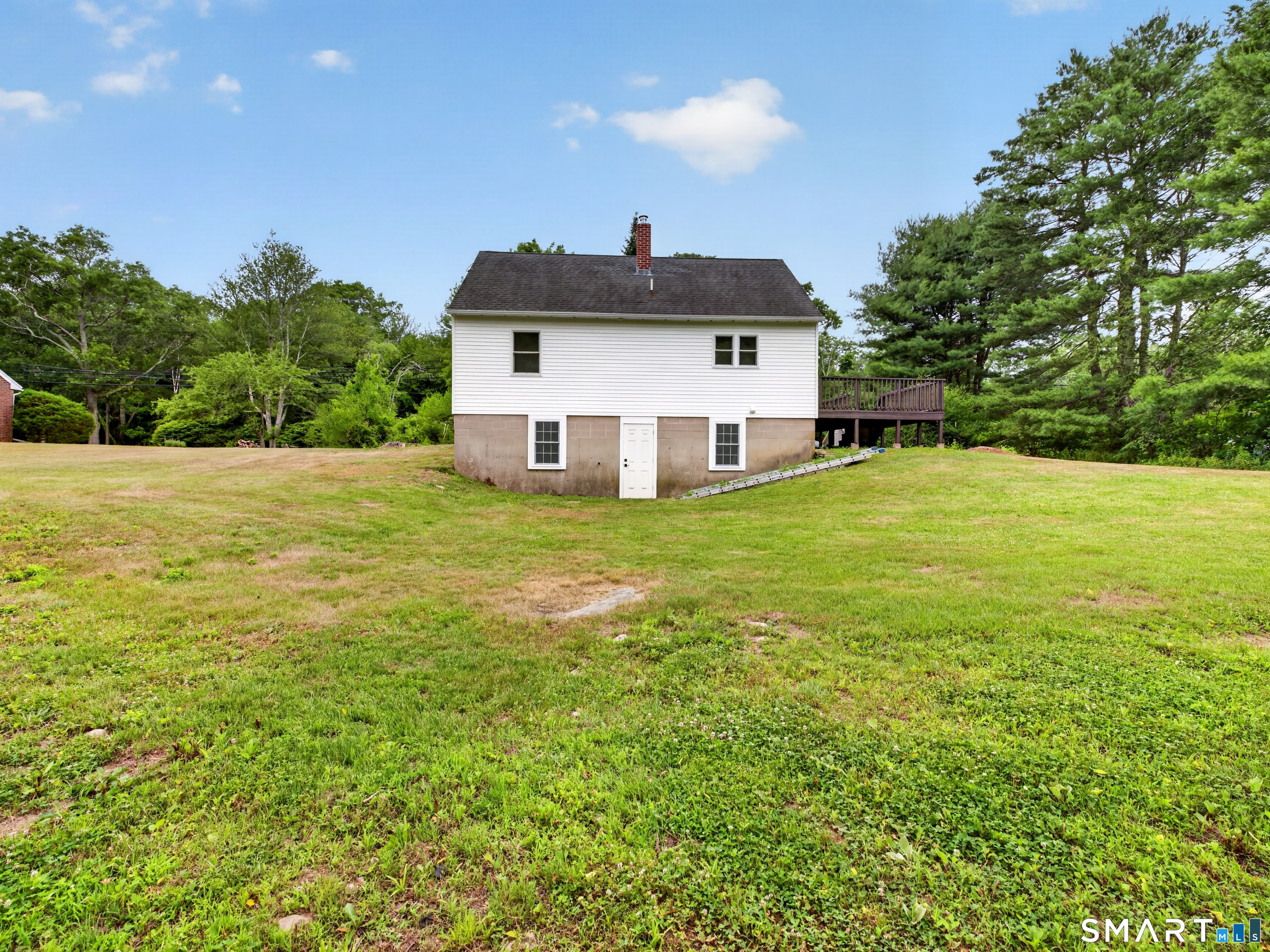 1039 N Road Groton, CT 06340 - Photo 24 of 26 a front view of a house with a yard