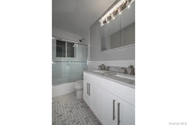 a bathroom with a sink and a toilet