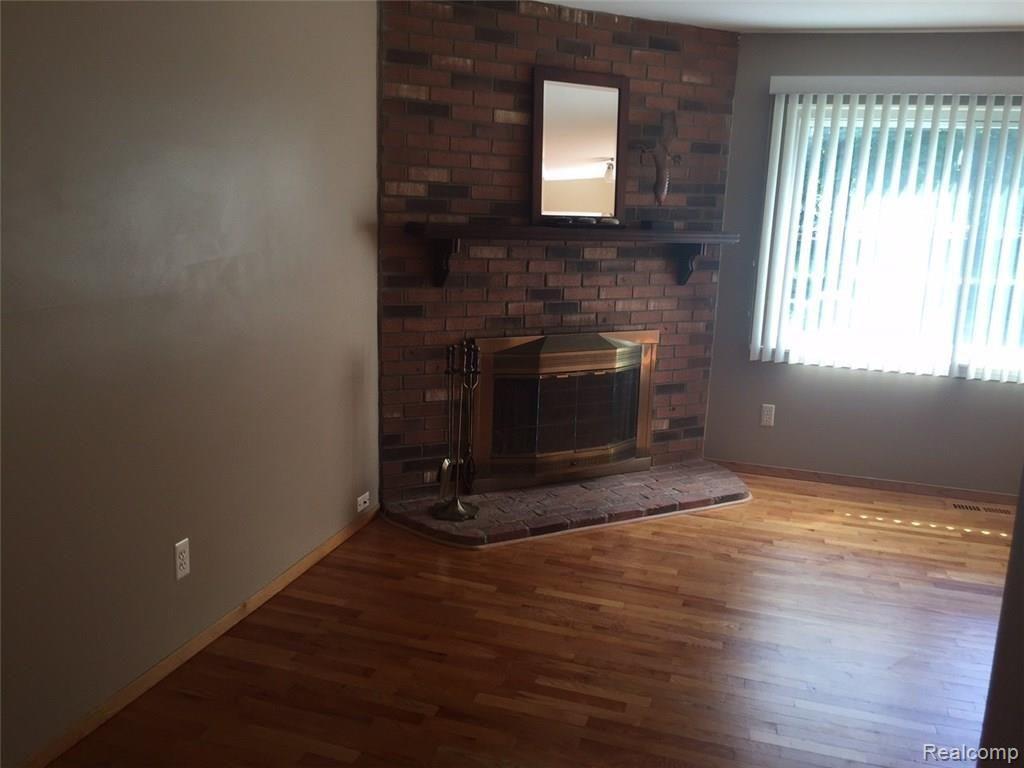 41717 Cherry Hill Road Novi, MI 48375 - Photo 13 of 41 Natural fireplace in living room.