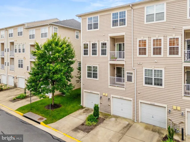 a front view of a building with garden