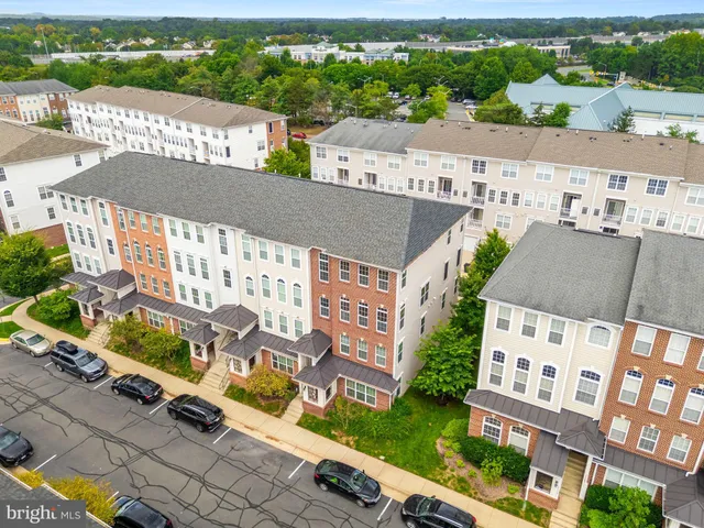 an aerial view of a city with lots of residential buildings
