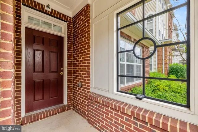 a view of a door with a door and wooden floor