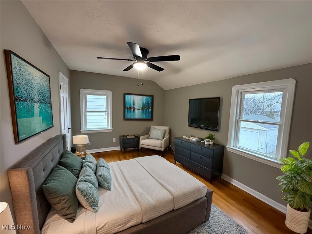 6807 Gerald Avenue Parma, OH 44129 - Photo 18 of 25 Bedroom with a ceiling fan, lofted ceiling, baseboards, and wood finished floors virtually staged