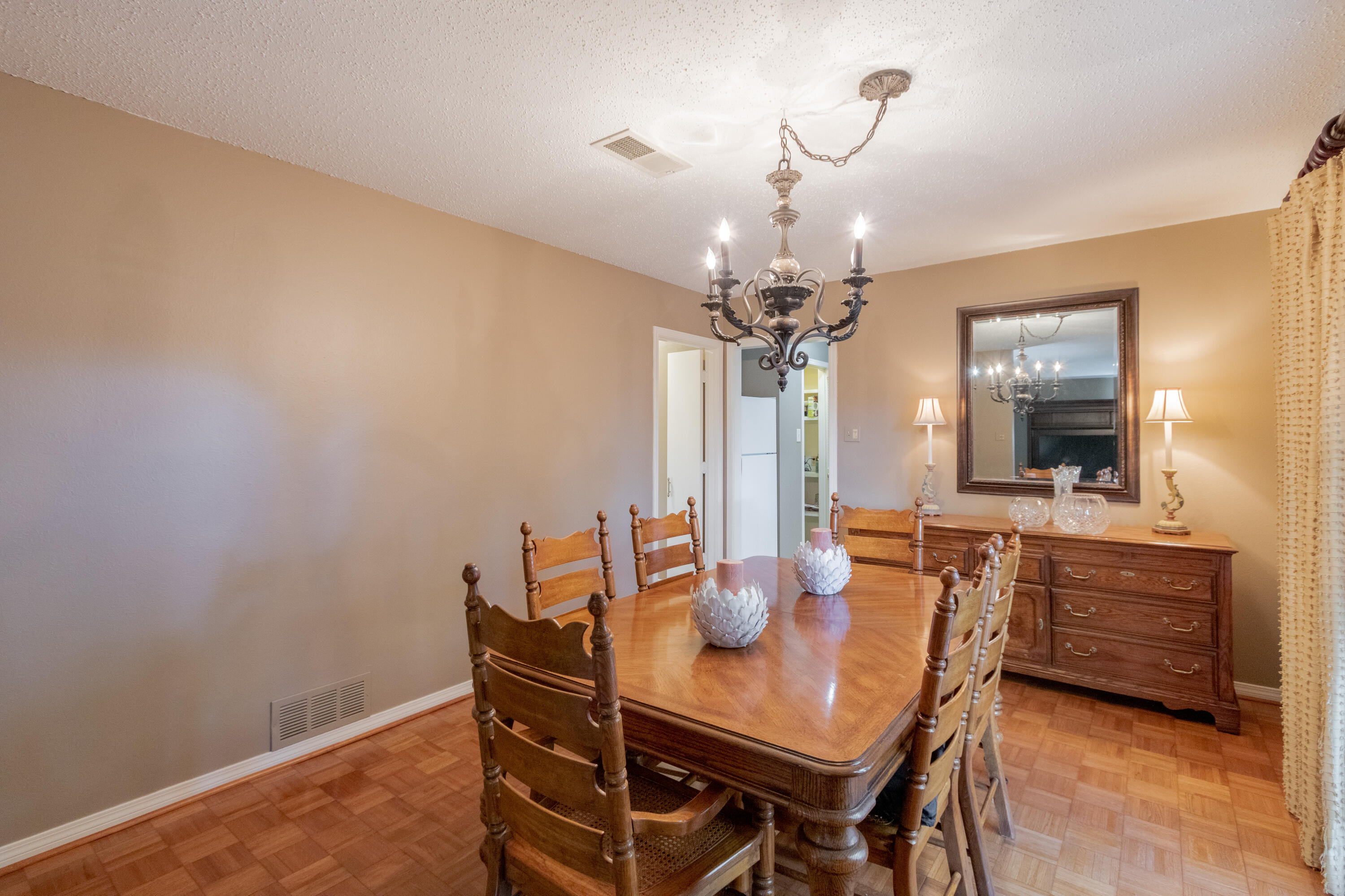 3722 63rd Drive Lubbock, TX 79413 - Photo 17 of 63 a view of a dining room with furniture and chandelier