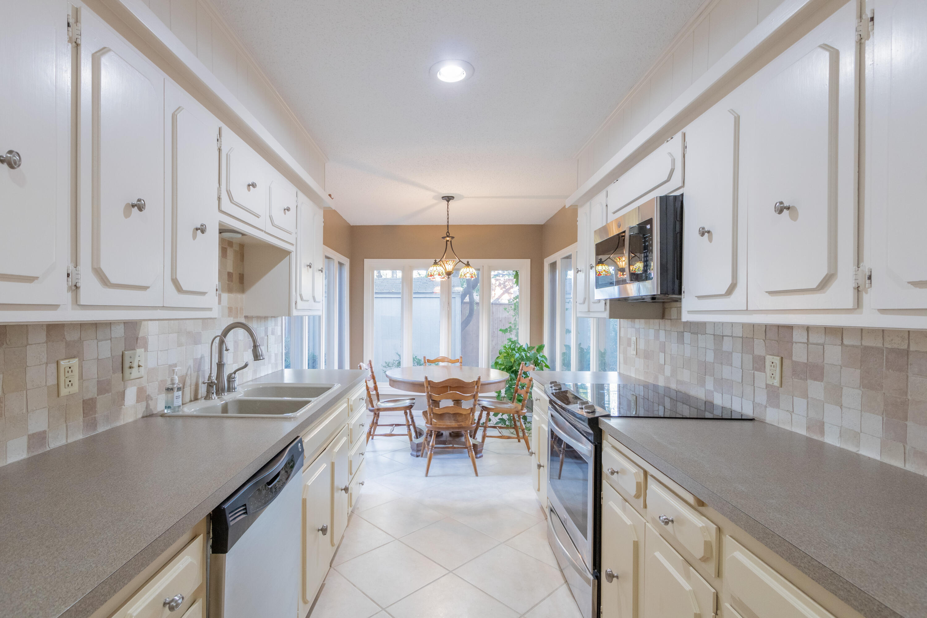 3722 63rd Drive Lubbock, TX 79413 - Photo 21 of 63 a kitchen with granite countertop a sink and cabinets