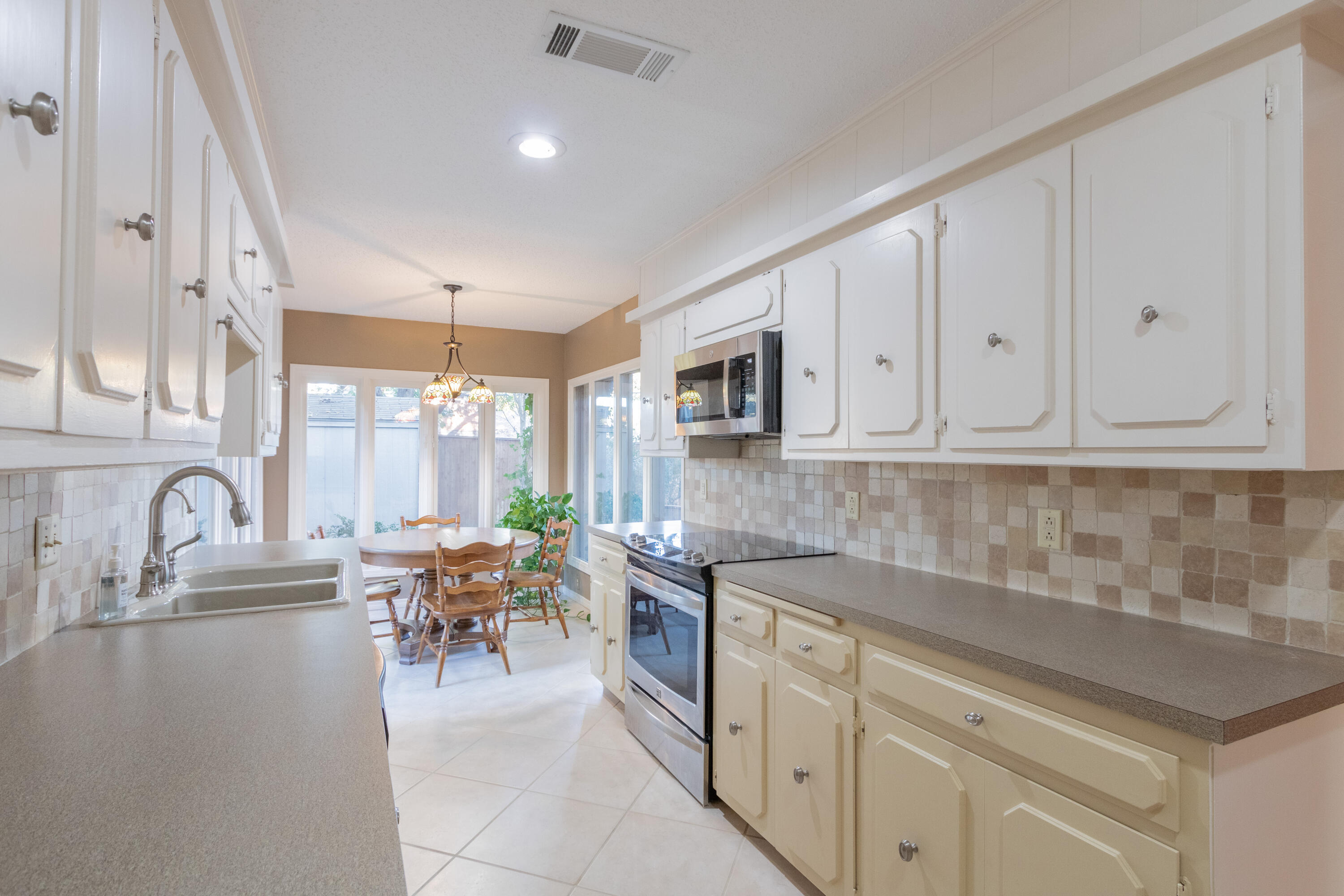 3722 63rd Drive Lubbock, TX 79413 - Photo 22 of 63 a kitchen with granite countertop a sink and cabinets