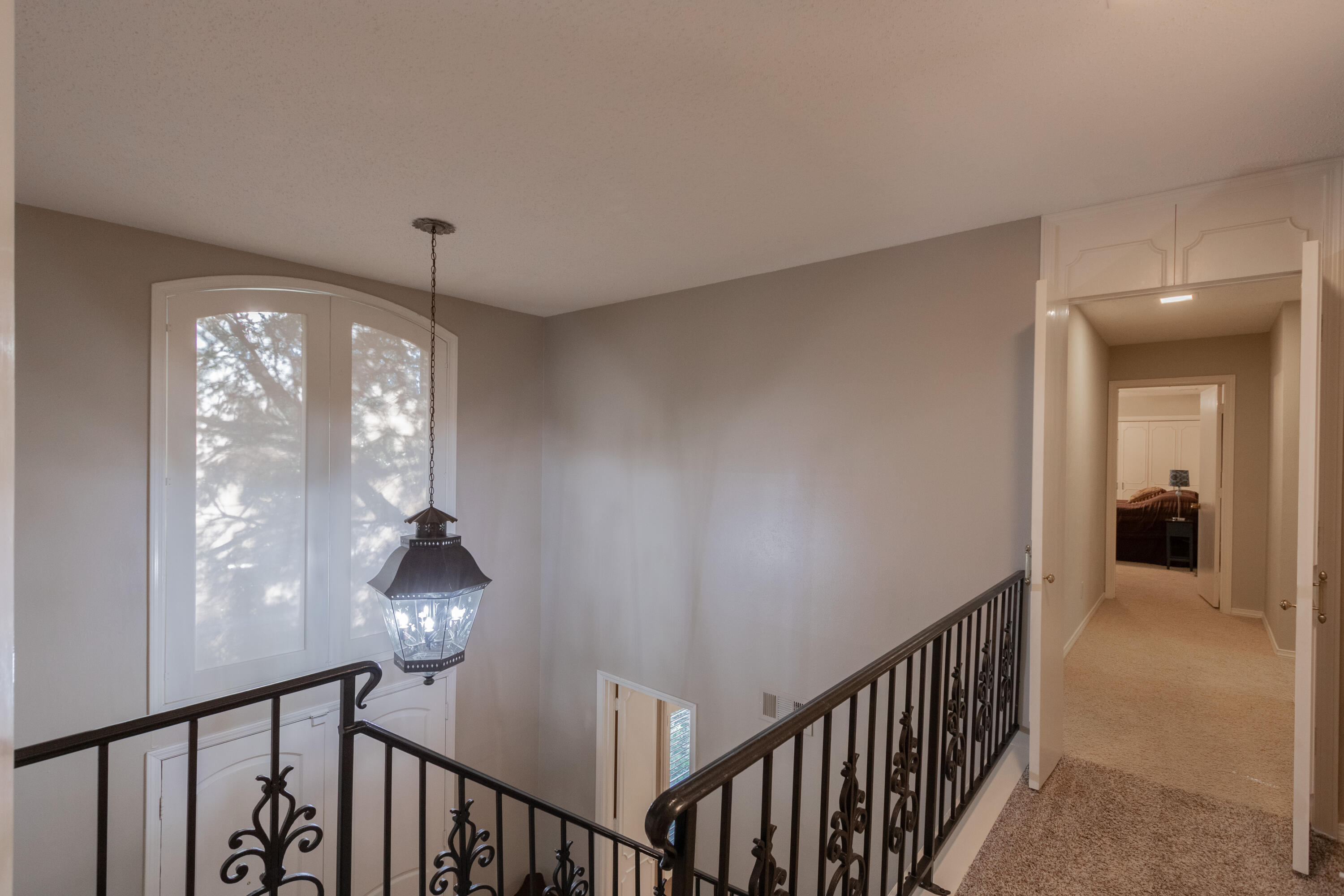 3722 63rd Drive Lubbock, TX 79413 - Photo 26 of 63 a view of a hallway with windows and chandelier