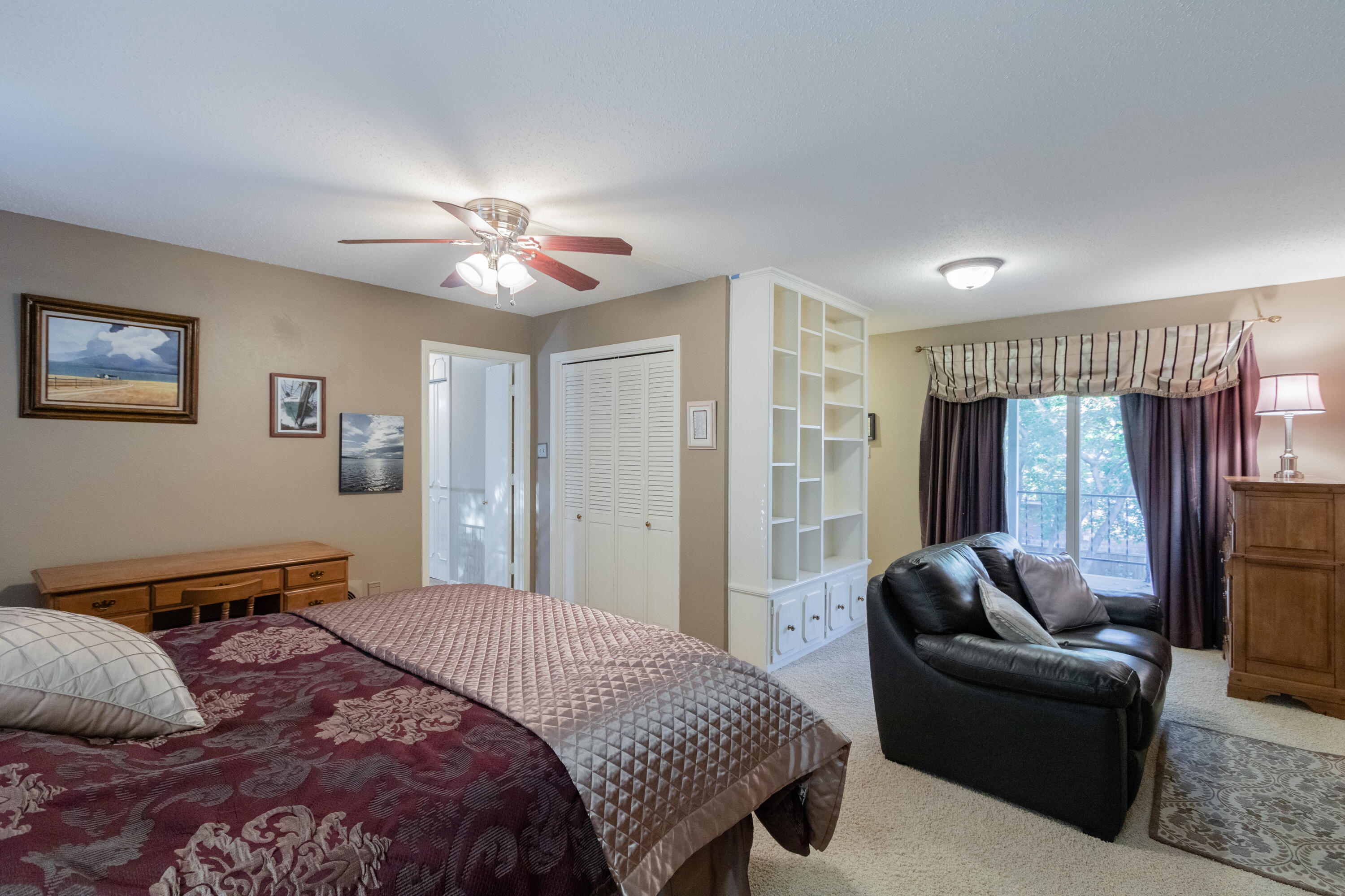 3722 63rd Drive Lubbock, TX 79413 - Photo 29 of 63 a bedroom with a bed couch and window
