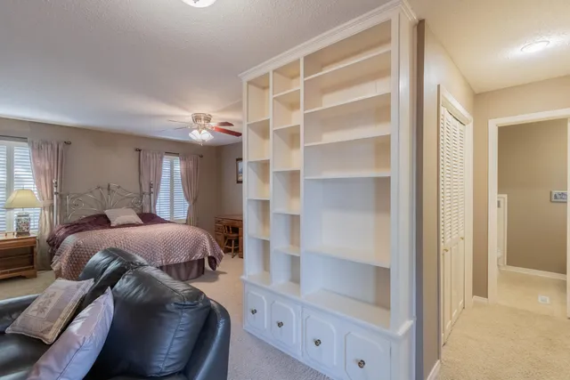 a bedroom with a bed and a closet