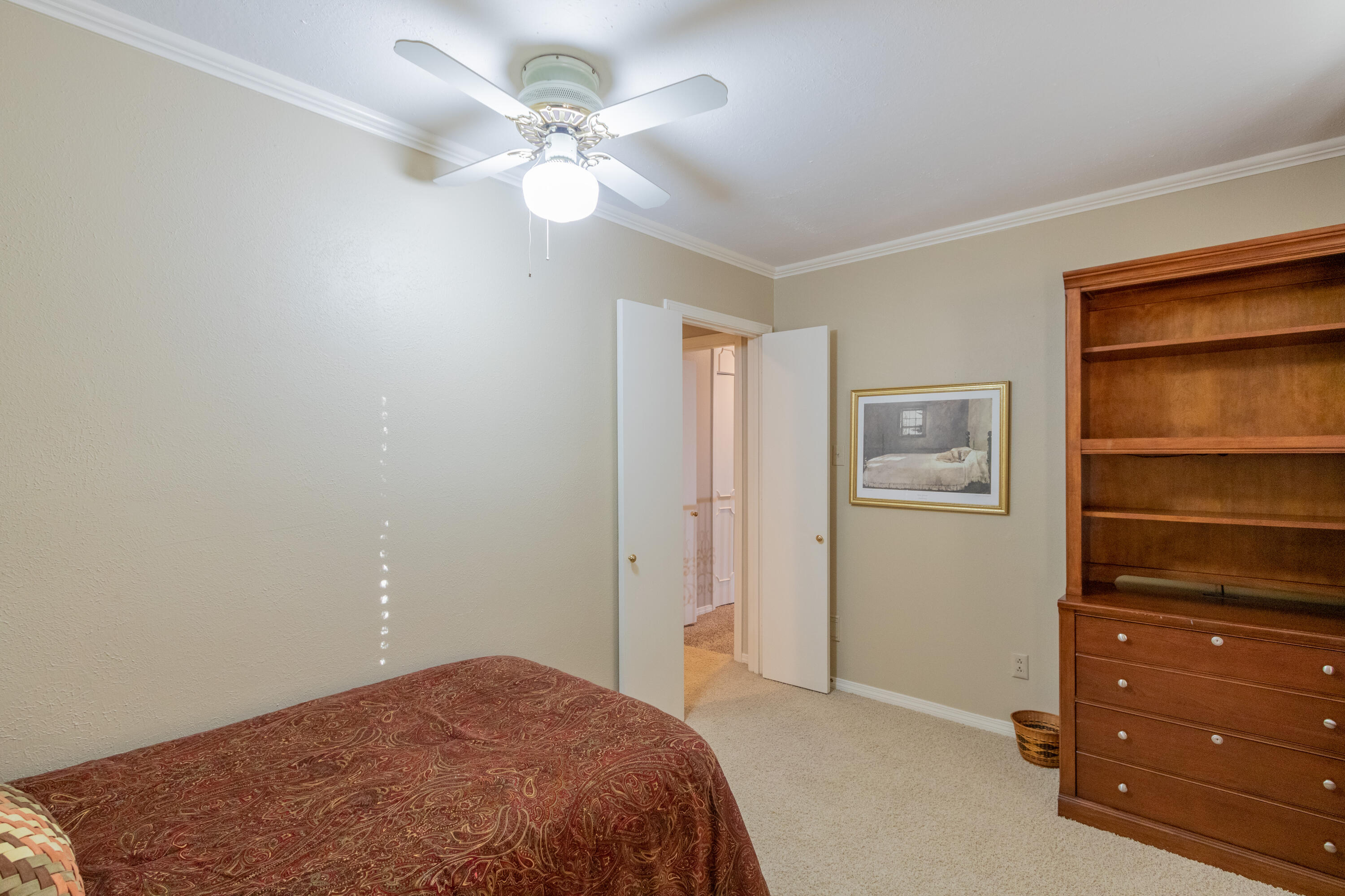 3722 63rd Drive Lubbock, TX 79413 - Photo 41 of 63 a bedroom with a bed and a closet