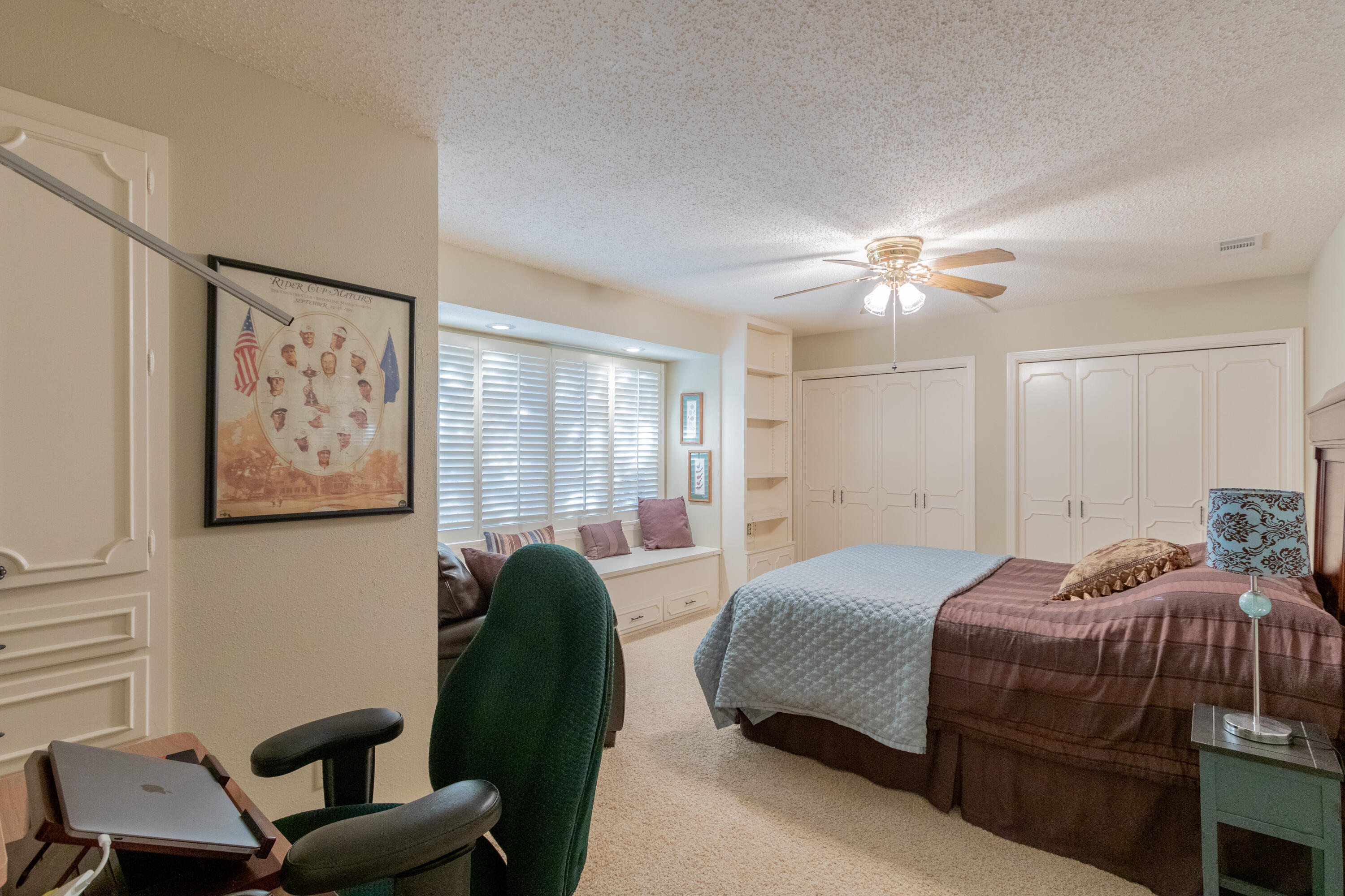 3722 63rd Drive Lubbock, TX 79413 - Photo 42 of 63 a bedroom with a bed and a chandelier