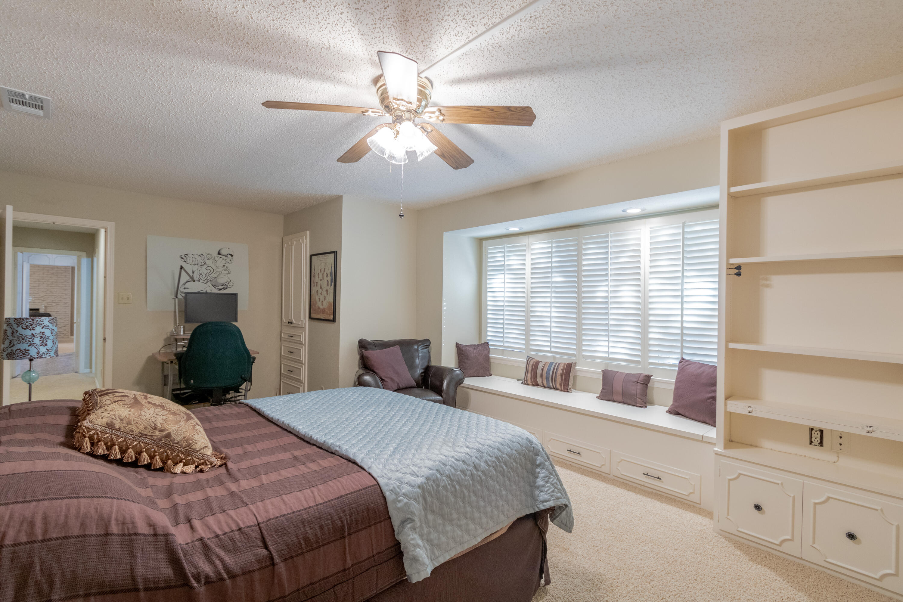 3722 63rd Drive Lubbock, TX 79413 - Photo 43 of 63 a bedroom with a large bed and a window