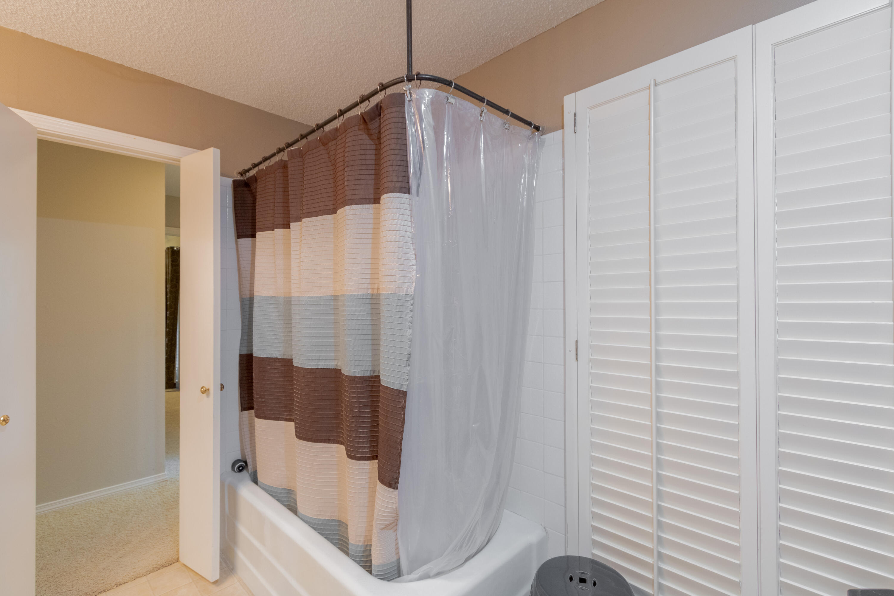 3722 63rd Drive Lubbock, TX 79413 - Photo 49 of 63 a bathroom with a shower and toilet
