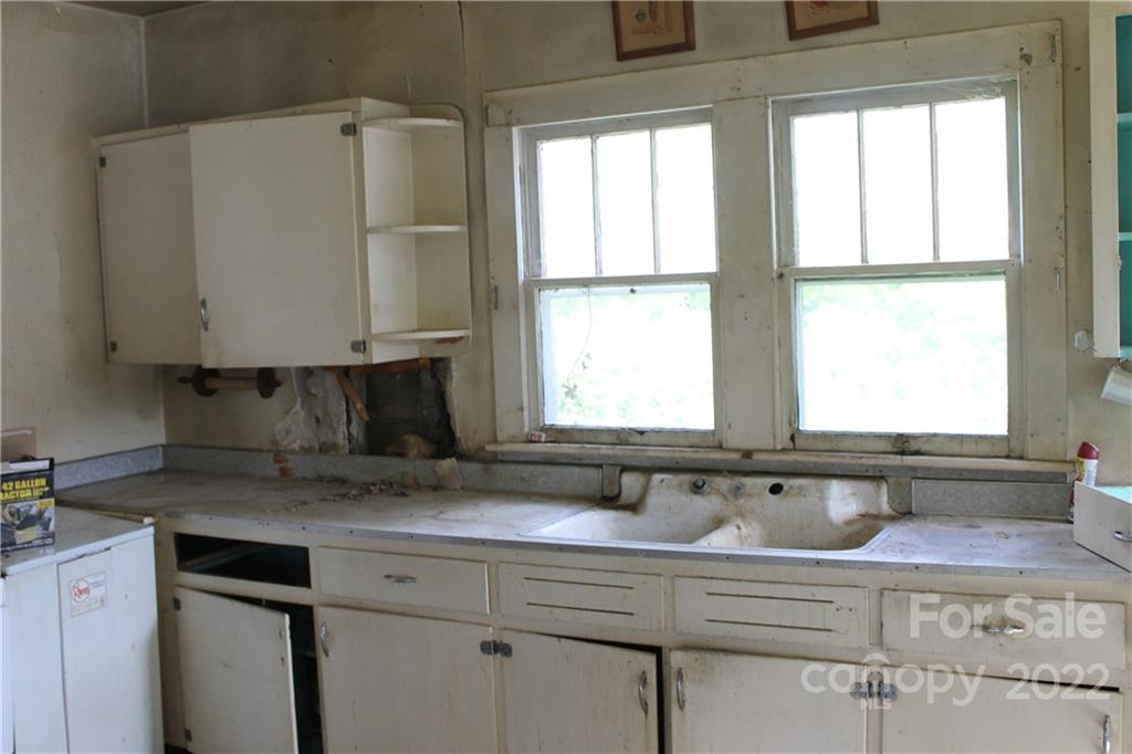 2063 Newfound Road Canton, NC 28716 - Photo 19 of 36 a view of window with kitchen sink and cabinets
