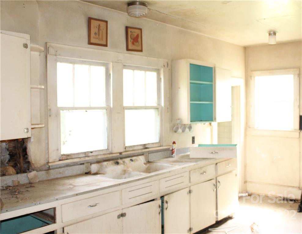 2063 Newfound Road Canton, NC 28716 - Photo 20 of 36 a bathroom with a sink and a window