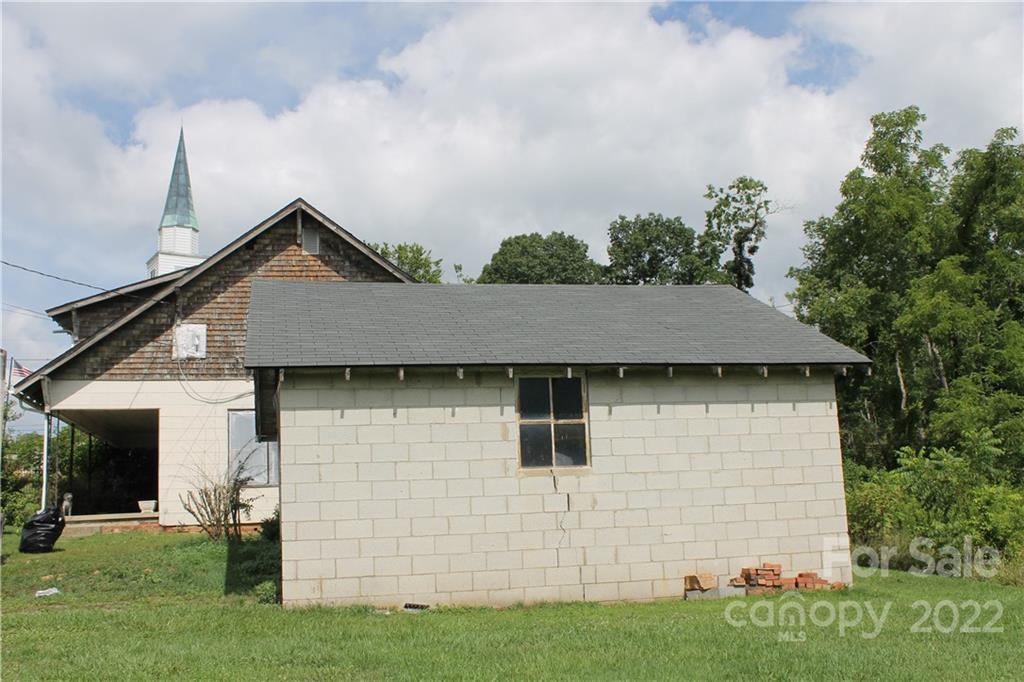 2063 Newfound Road Canton, NC 28716 - Photo 9 of 36 a front view of a house with a garden